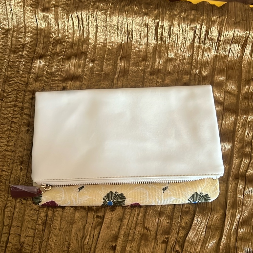 Rachel Paly reversible white and floral clutch.